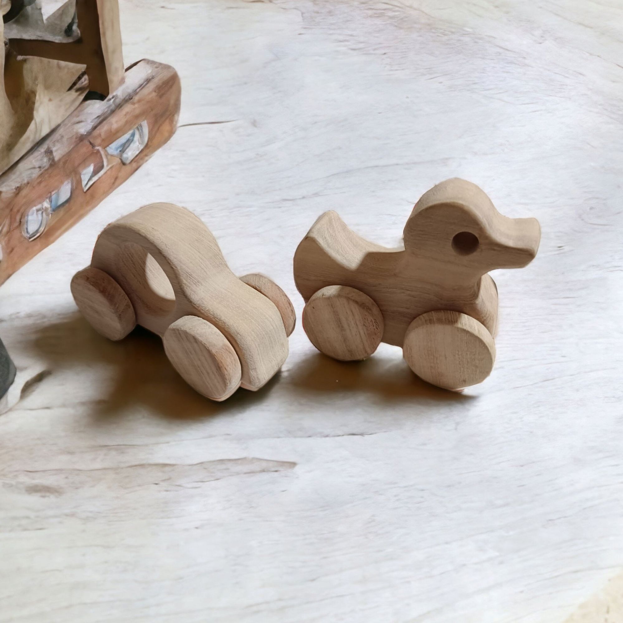 Pack of 2 Neem Wooden Wheel Toys - Car & Duck Shapes - Image 2
