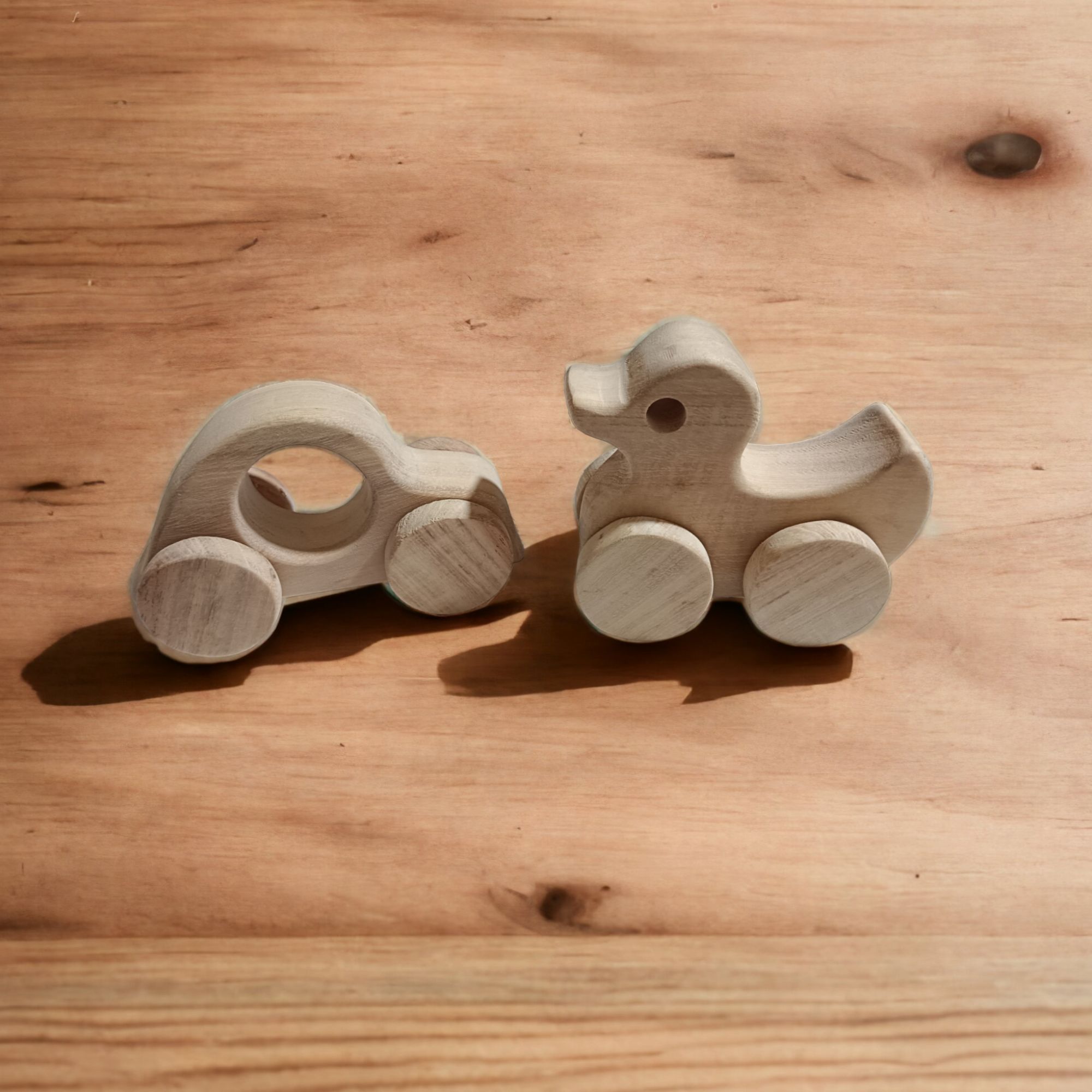 Pack of 2 Neem Wooden Wheel Toys - Car & Duck Shapes - Image 3